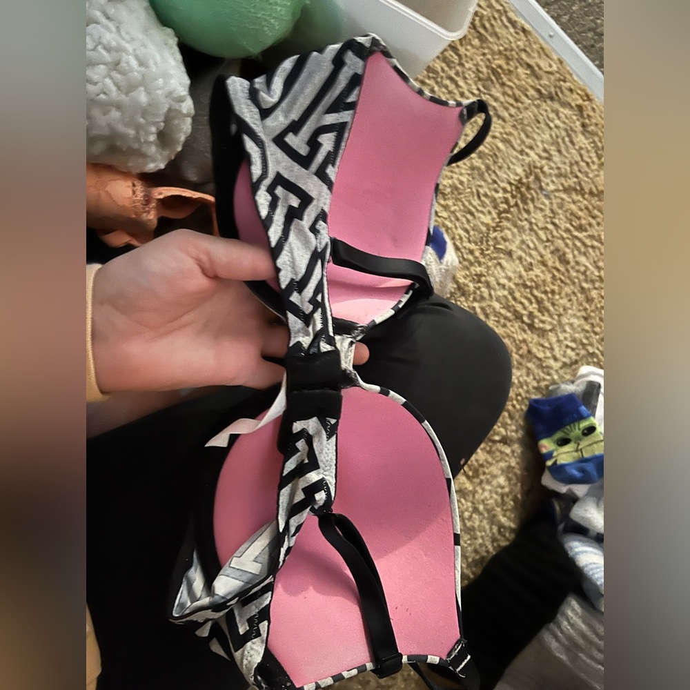 Black and grey with PINK as writing size 34D